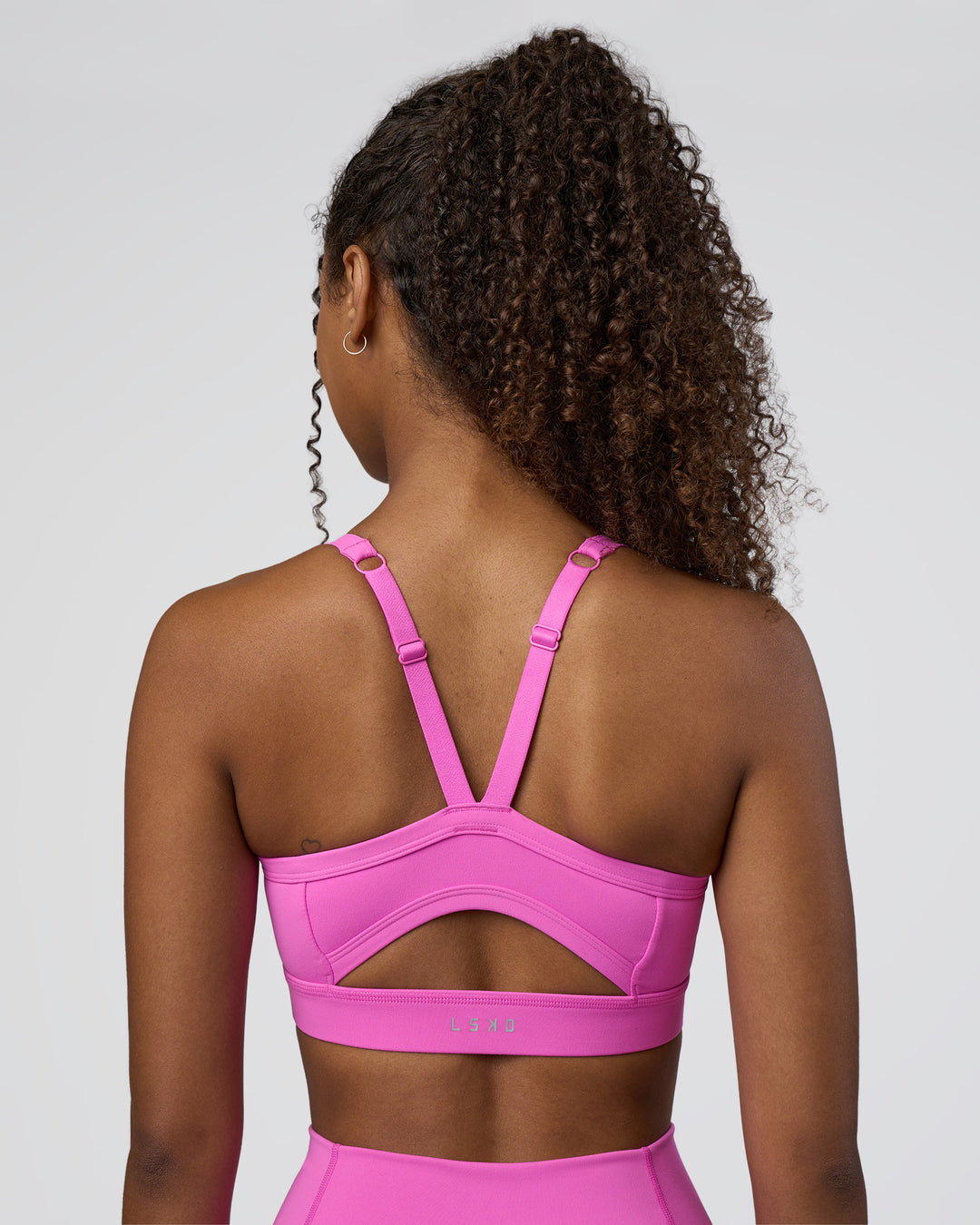 Woman wearing Momentum Sports Bra D/DD/E - Ultra Fuchsia | Model:Jordan | Size:XS - view 2