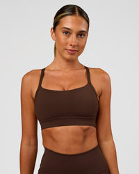 Woman wearing Momentum Sports Bra - Hot Chocolate | Model:Charli | Size:XS | Thumbnail Index: 0