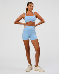 Woman wearing Momentum Sports Bra - Open Air | Model:Charli | Size:XS | Thumbnail Index: 2