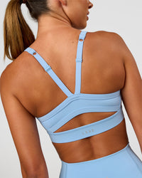 Woman wearing Momentum Sports Bra - Open Air | Model:Charli | Size:XS | Thumbnail Index: 1