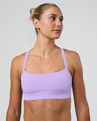 Woman wearing Momentum Sports Bra - Pale Lilac | Model:Emelia | Size:XS | Thumbnail Index: 0