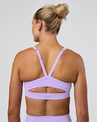 Woman wearing Momentum Sports Bra - Pale Lilac | Model:Emelia | Size:XS | Thumbnail Index: 4