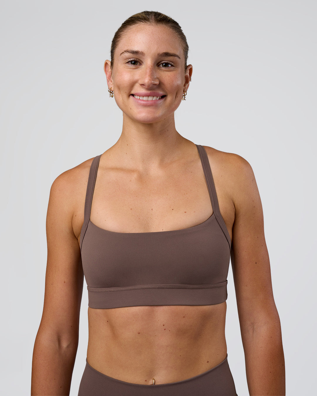 Woman wearing Momentum Sports Bra - Peppercorn | Model:Peppercorn | Size:XS - view 3