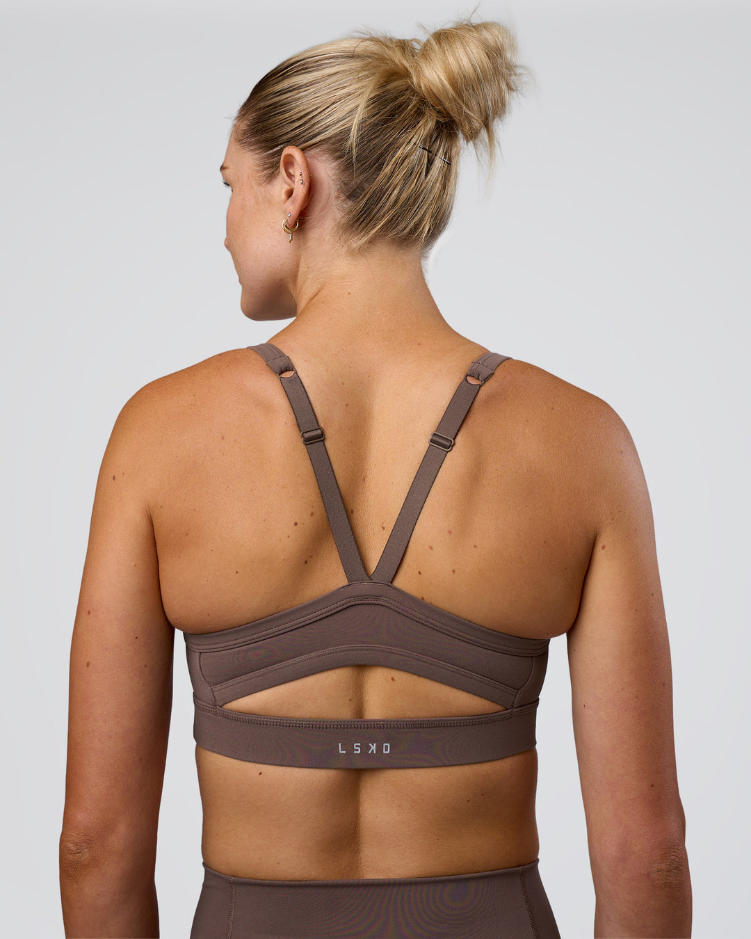Woman wearing Momentum Sports Bra - Peppercorn | Model:Peppercorn | Size:XS - view 2