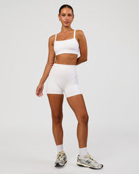 Woman wearing Momentum Sports Bra - White | Model:Brylee | Size:XS | Thumbnail Index: 5