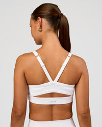 Woman wearing Momentum Sports Bra - White | Model:Brylee | Size:XS | Thumbnail Index: 4