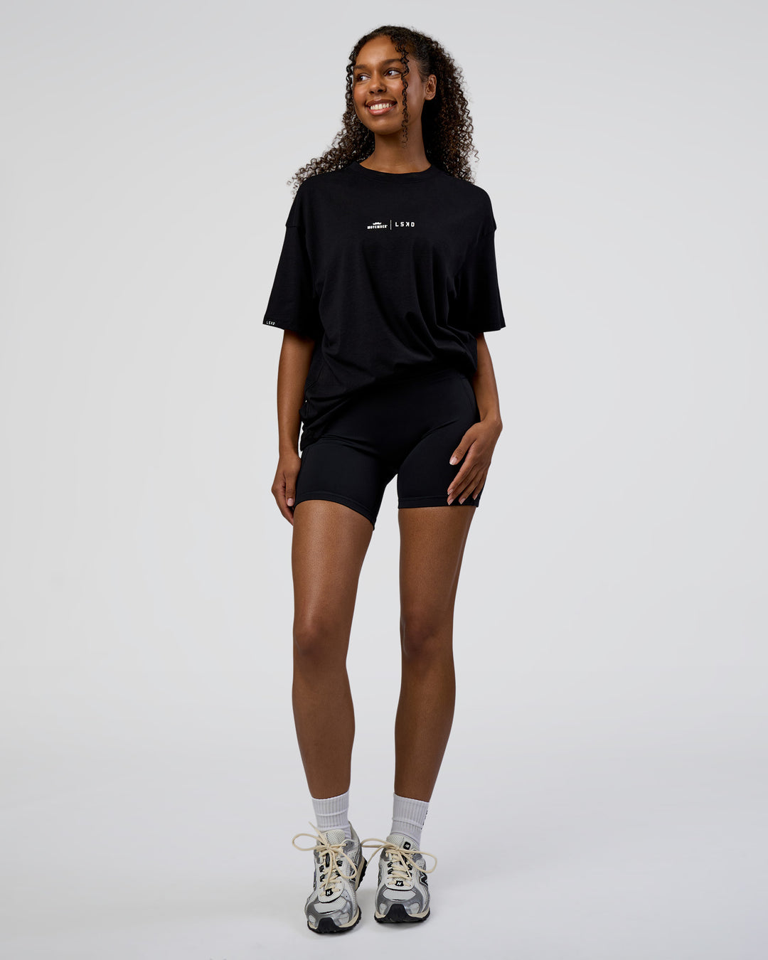 Woman wearing Movember 2025 FLXCotton Oversize Tee - Black | Model:Jordan | Size:XS - view 10