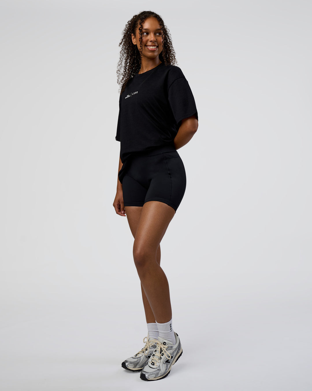 Woman wearing Movember 2025 FLXCotton Oversize Tee - Black | Model:Jordan | Size:XS - view 7