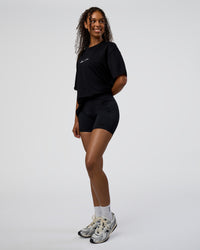 Woman wearing Movember 2025 FLXCotton Oversize Tee - Black | Model:Jordan | Size:XS | Thumbnail Index: 6