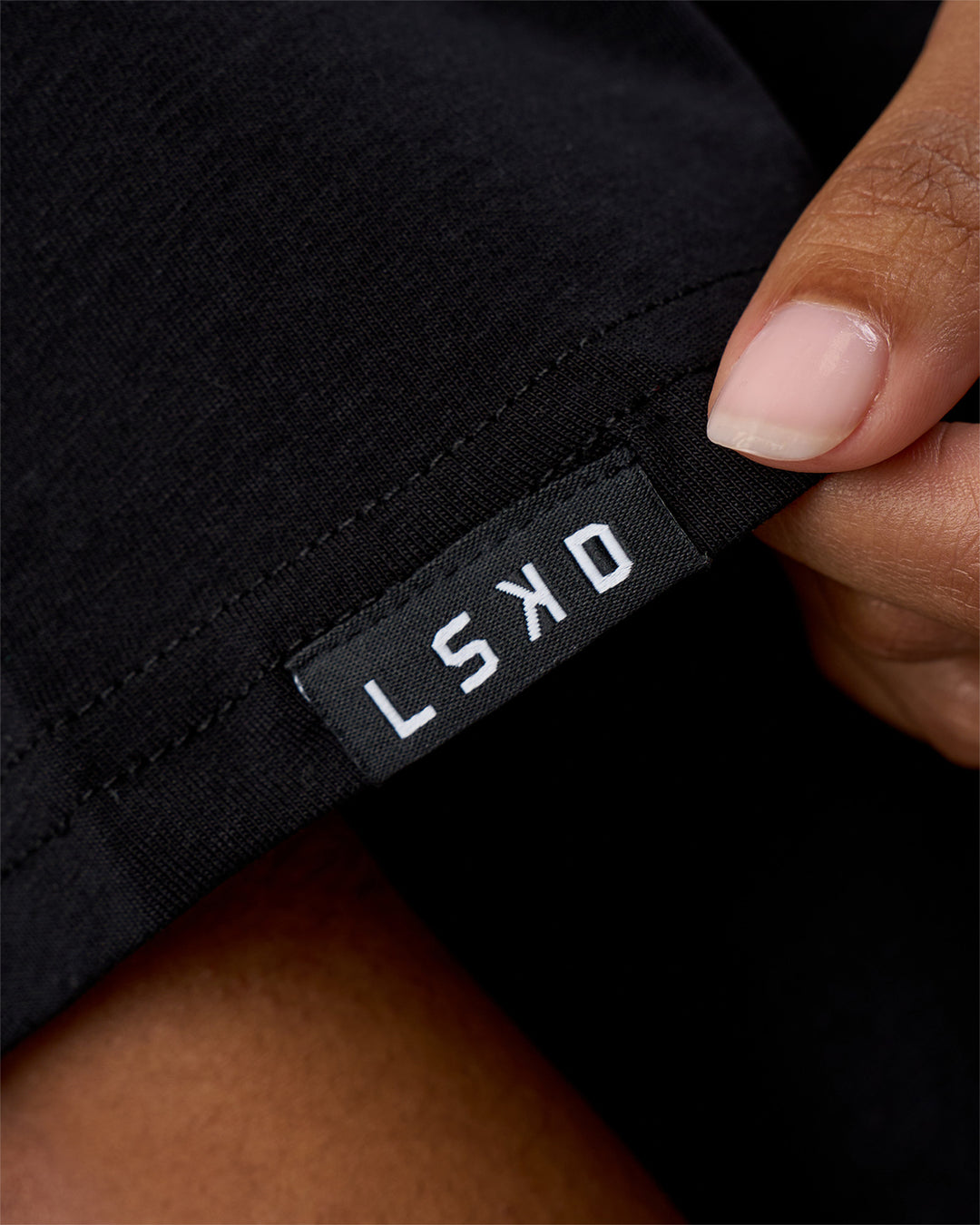 Woman wearing Movember 2025 FLXCotton Oversize Tee - Black | Model:Jordan | Size:XS - view 8