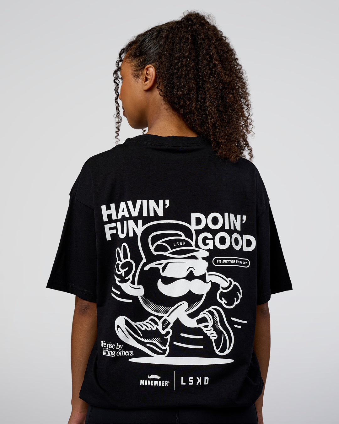 Woman wearing Movember 2025 FLXCotton Oversize Tee - Black | Model:Jordan | Size:XS - view 4