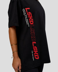 Woman wearing Nothing Is Impossible FLXCotton Oversized Tee - Black-Flame | Model:Bianca | Size:XS | Thumbnail Index: 4