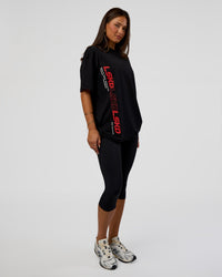 Woman wearing Nothing Is Impossible FLXCotton Oversized Tee - Black-Flame | Model:Bianca | Size:XS | Thumbnail Index: 12