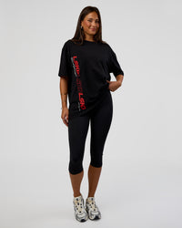 Woman wearing Nothing Is Impossible FLXCotton Oversized Tee - Black-Flame | Model:Bianca | Size:XS | Thumbnail Index: 7