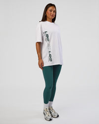 Woman wearing Nothing Is Impossible FLXCotton Oversized Tee - White-Vital Green | Model:Bianca | Size:XS | Thumbnail Index: 4