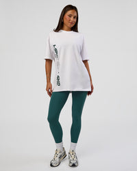 Woman wearing Nothing Is Impossible FLXCotton Oversized Tee - White-Vital Green | Model:Bianca | Size:XS | Thumbnail Index: 12