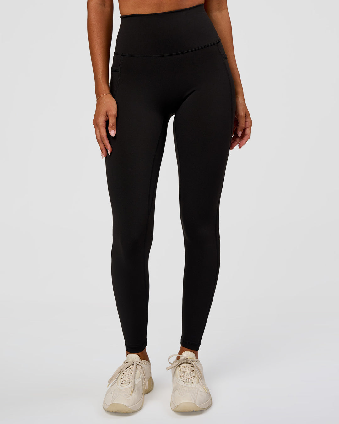 Woman wearing O.G Fusion Ultra High-Rise Full Length Legging Pockets - Black | Model:Charli | Size:XS - view 1