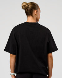 Woman wearing Offset Heavyweight Unisex Oversized Tee - Black Washed-Castlerock | Model:Maja | Size:XS | Thumbnail Index: 7