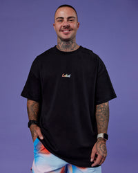Man wearing Our Journey Heavyweight Oversized Tee - Black-Rainbow | Model:Tayden | Size:XS | Thumbnail Index: 7