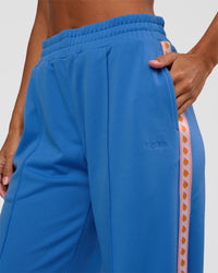 Woman wearing Peaches Track Pant - Palace Blue | Model:Brylee | Size:XS | Thumbnail Index: 6