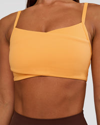Woman wearing Peaches Wrap Sports Bra - Warm Apricot | Model:Brylee | Size:XS | Thumbnail Index: 5