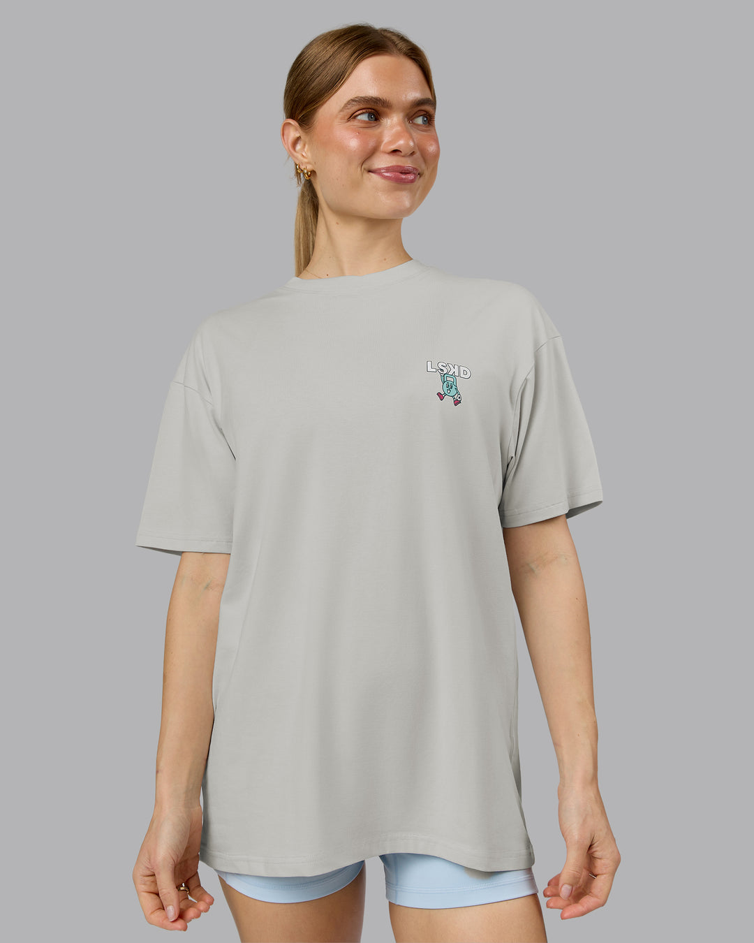 Woman wearing Perspective FLXCotton Oversized Tee - Digital Mist-White | Model:Emilie | Size:XS - view 3