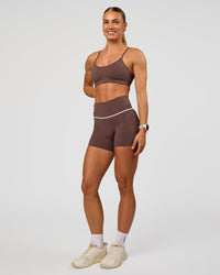 Woman wearing Pinnacle High-Rise 4" Short - Cocoa Powder-Off White | Model:Maja | Size:XS | Thumbnail Index: 2