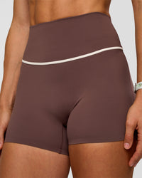 Woman wearing Pinnacle High-Rise 4" Short - Cocoa Powder-Off White | Model:Maja | Size:XS | Thumbnail Index: 4