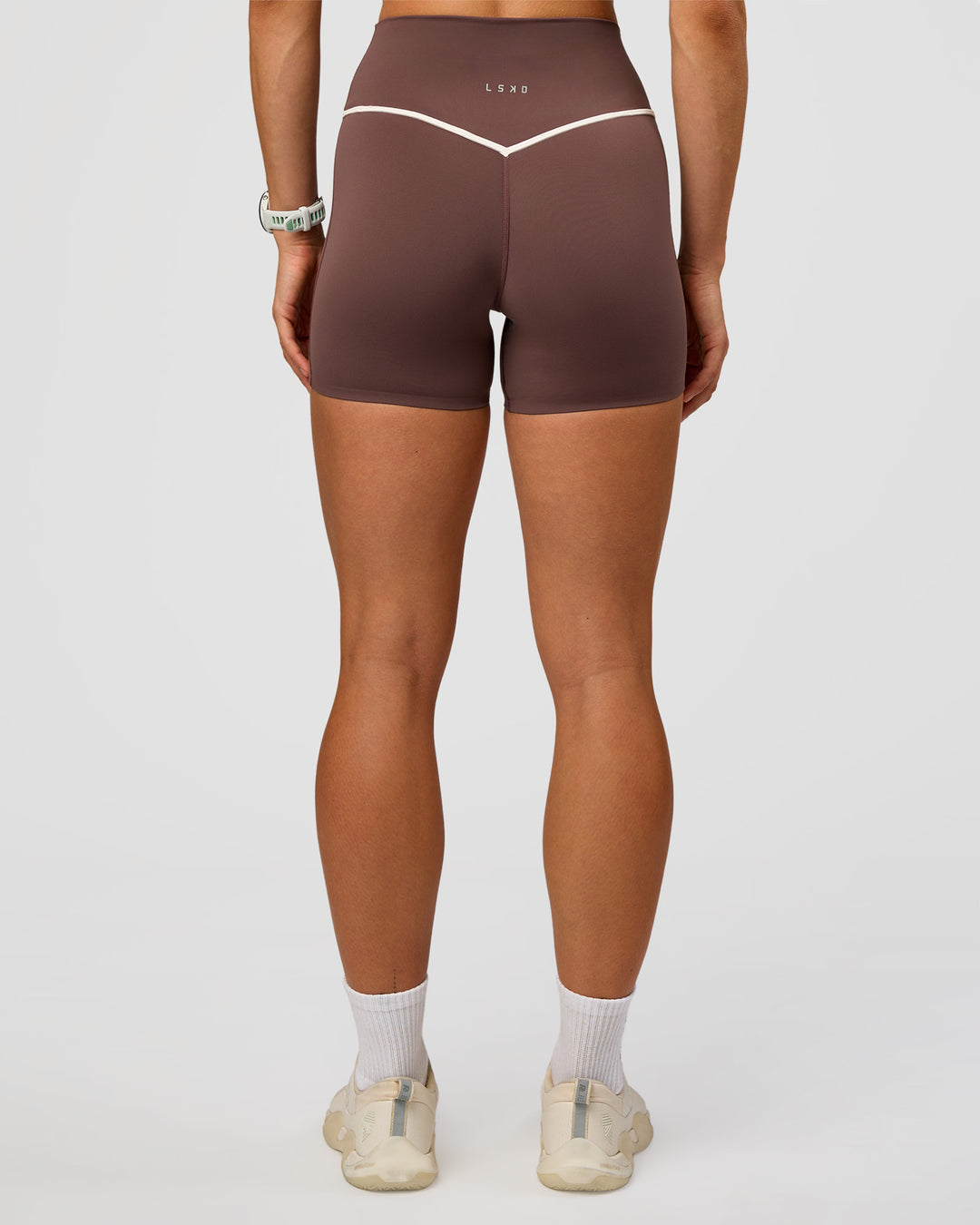Woman wearing Pinnacle High-Rise 4" Short - Cocoa Powder-Off White | Model:Maja | Size:XS - view 7