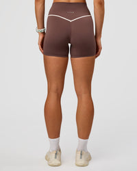 Woman wearing Pinnacle High-Rise 4" Short - Cocoa Powder-Off White | Model:Maja | Size:XS | Thumbnail Index: 6