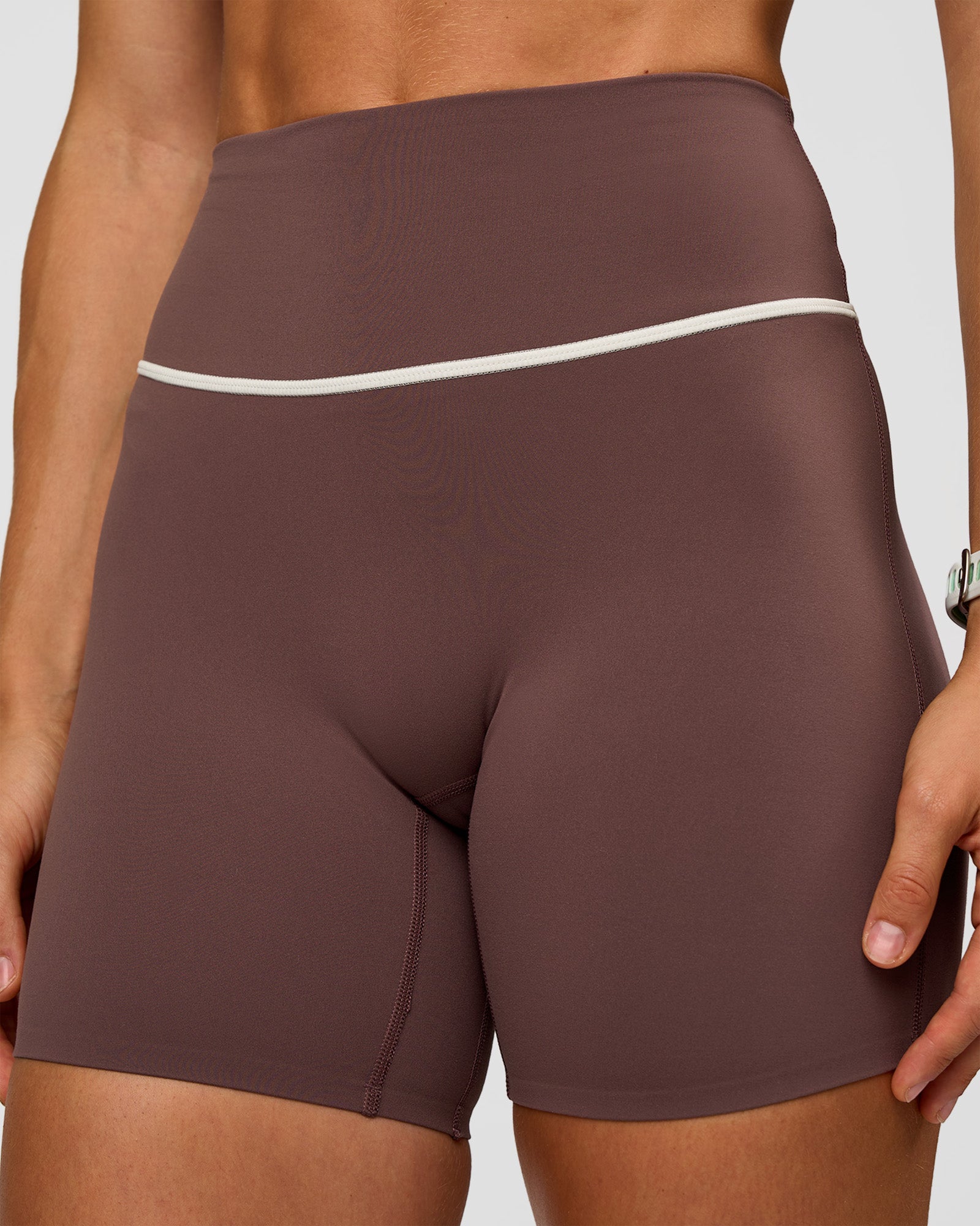 Woman wearing Pinnacle High-Rise 6" Short - Cocoa Powder-Off White | Model:Maja | Size:XS