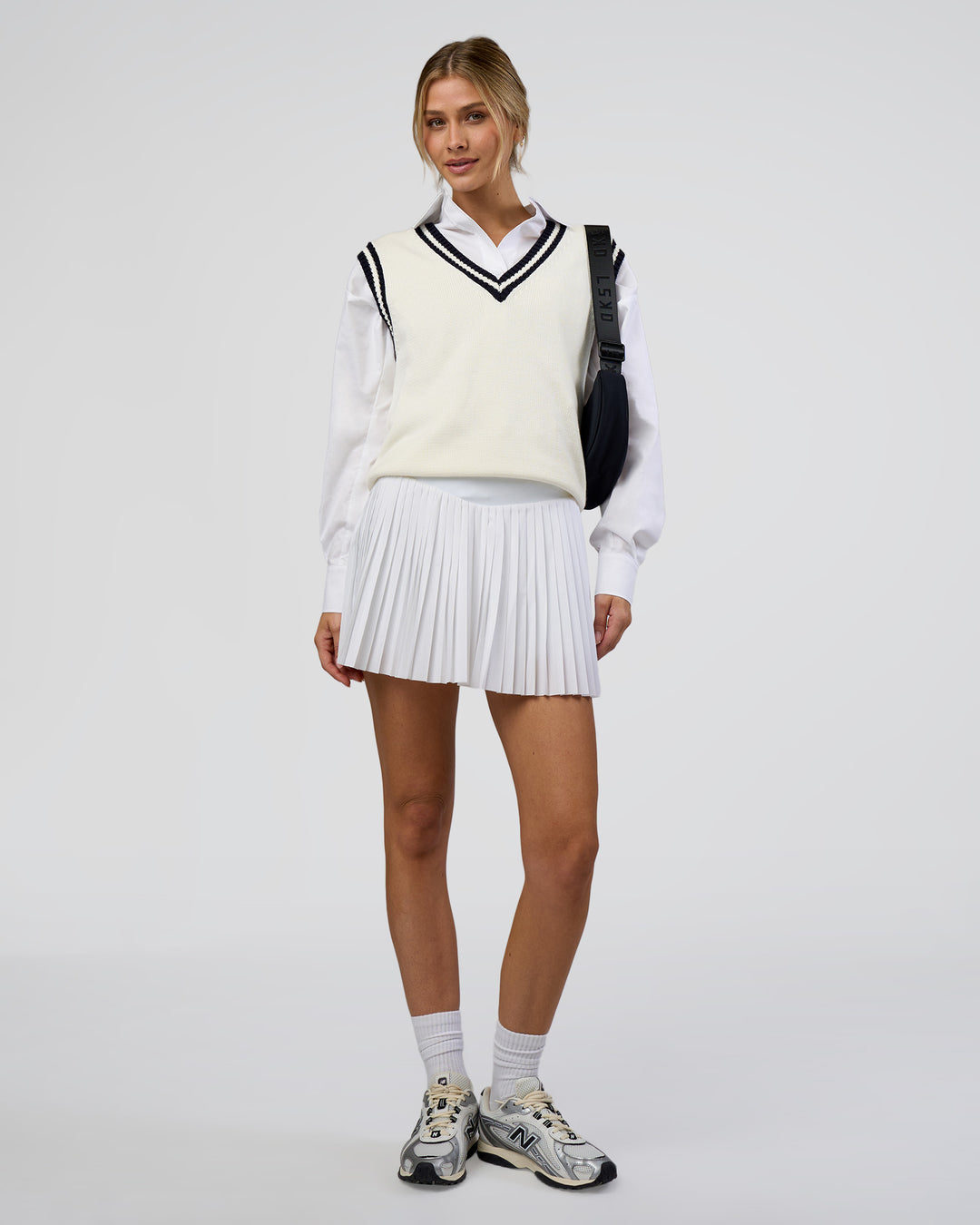 Woman wearing Precision Active Skirt - White | Model:Leilani | Size:XS - view 8