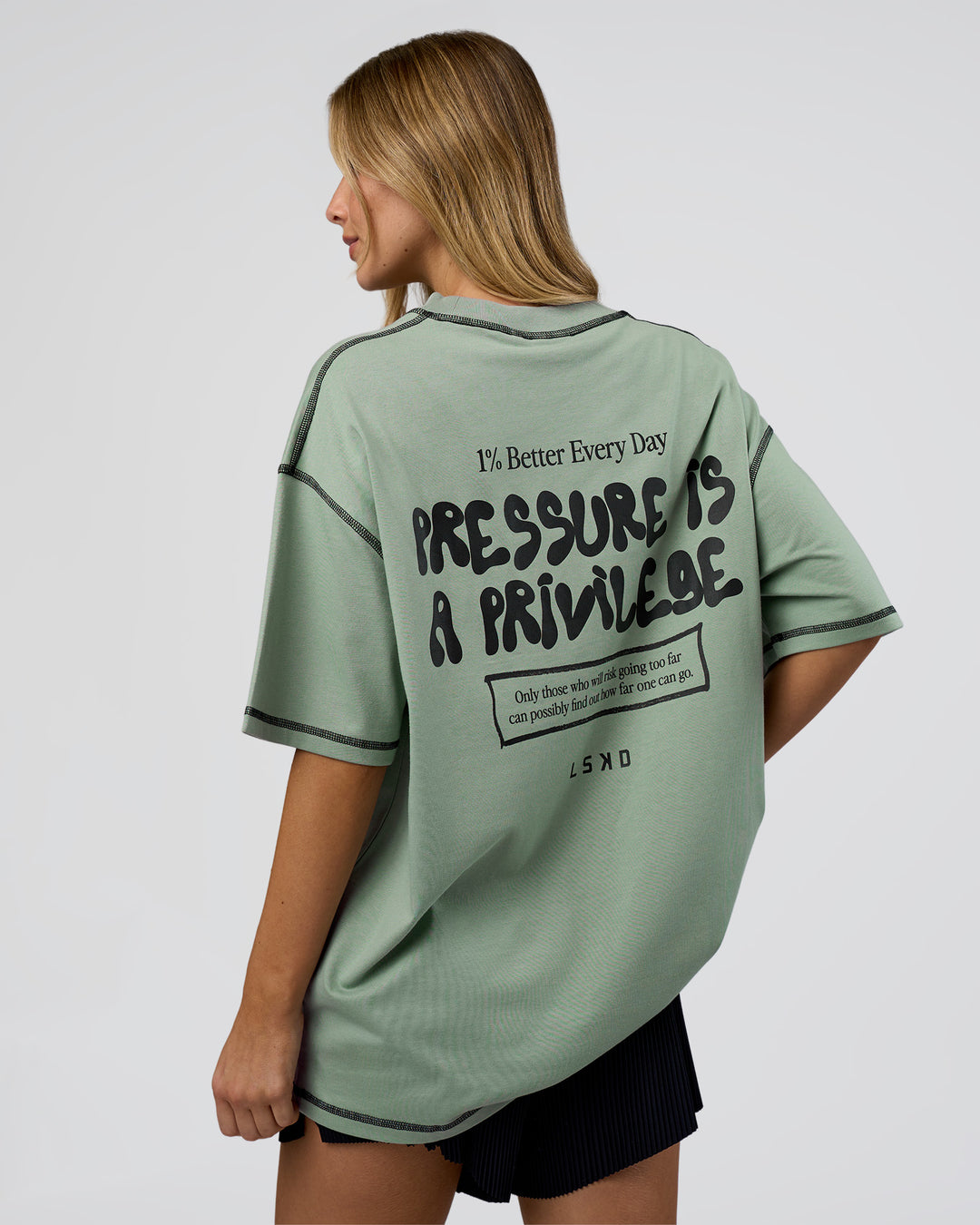 Woman wearing Pressure is Privilege Oversized Tee - Iceberg Green-Black | Model:Leilani | Size:XS - view 4