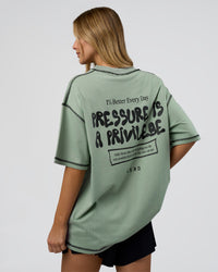 Woman wearing Pressure is Privilege Oversized Tee - Iceberg Green-Black | Model:Leilani | Size:XS | Thumbnail Index: 3