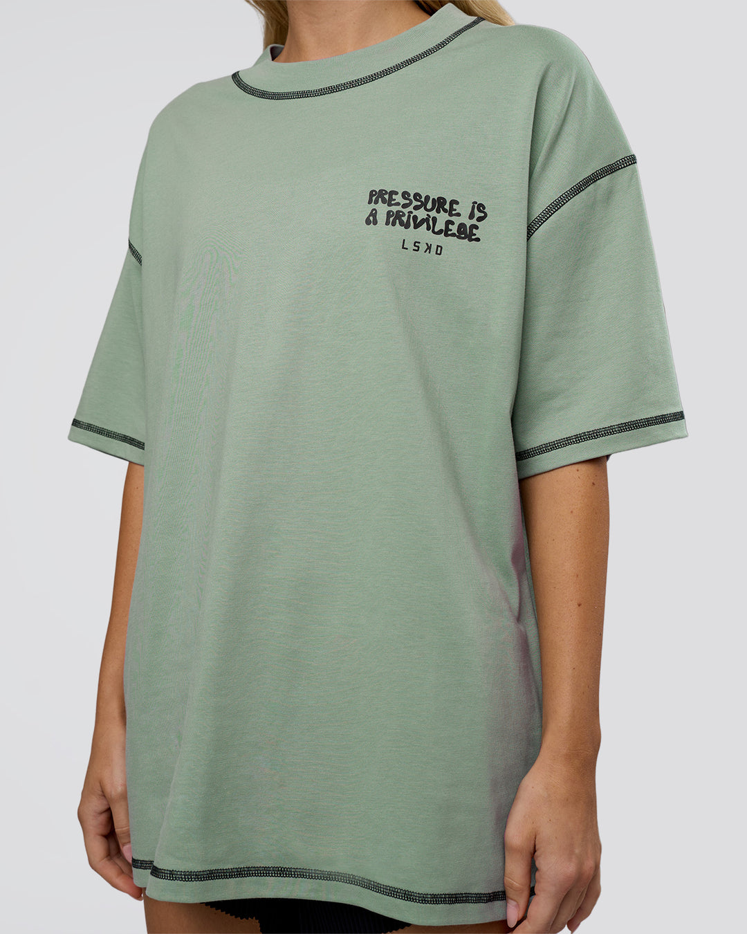 Woman wearing Pressure is Privilege Oversized Tee - Iceberg Green-Black | Model:Leilani | Size:XS - view 11