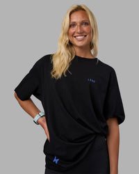 Woman wearing Pressure is a Privilege FLXCotton Oversized Tee - Black-Power Cobalt | Model:Alex | Size:XS | Thumbnail Index: 7