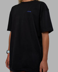Woman wearing Pressure is a Privilege FLXCotton Oversized Tee - Black-Power Cobalt | Model:Alex | Size:XS | Thumbnail Index: 8