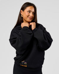 Woman wearing Pride Sticker Boxy Hoodie - Black | Model:Bianca | Size:XS | Thumbnail Index: 7