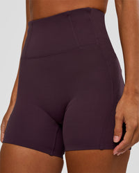 Woman wearing Progression Ultra High-Rise 4" Short - Midnight Plum | Model:Brylee | Size:XS | Thumbnail Index: 6