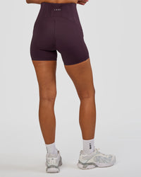 Woman wearing Progression Ultra High-Rise 4" Short - Midnight Plum | Model:Brylee | Size:XS | Thumbnail Index: 8
