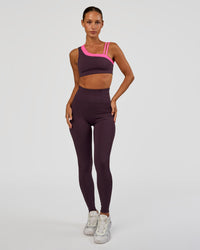 Woman wearing Progression Ultra High-Rise Full Length Legging - Midnight Plum | Model:Brylee | Size:XS | Thumbnail Index: 1