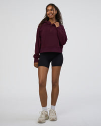 Woman wearing Pursue Mid-Weight Hoodie - Cherry Lacquer | Model:Jordan | Size:XS | Thumbnail Index: 1