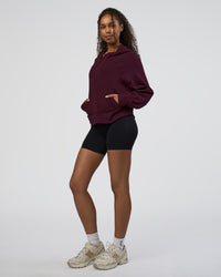 Woman wearing Pursue Mid-Weight Hoodie - Cherry Lacquer | Model:Jordan | Size:XS | Thumbnail Index: 4