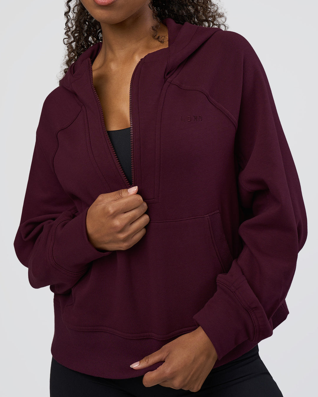 Woman wearing Pursue Mid-Weight Hoodie - Cherry Lacquer | Model:Jordan | Size:XS - view 4