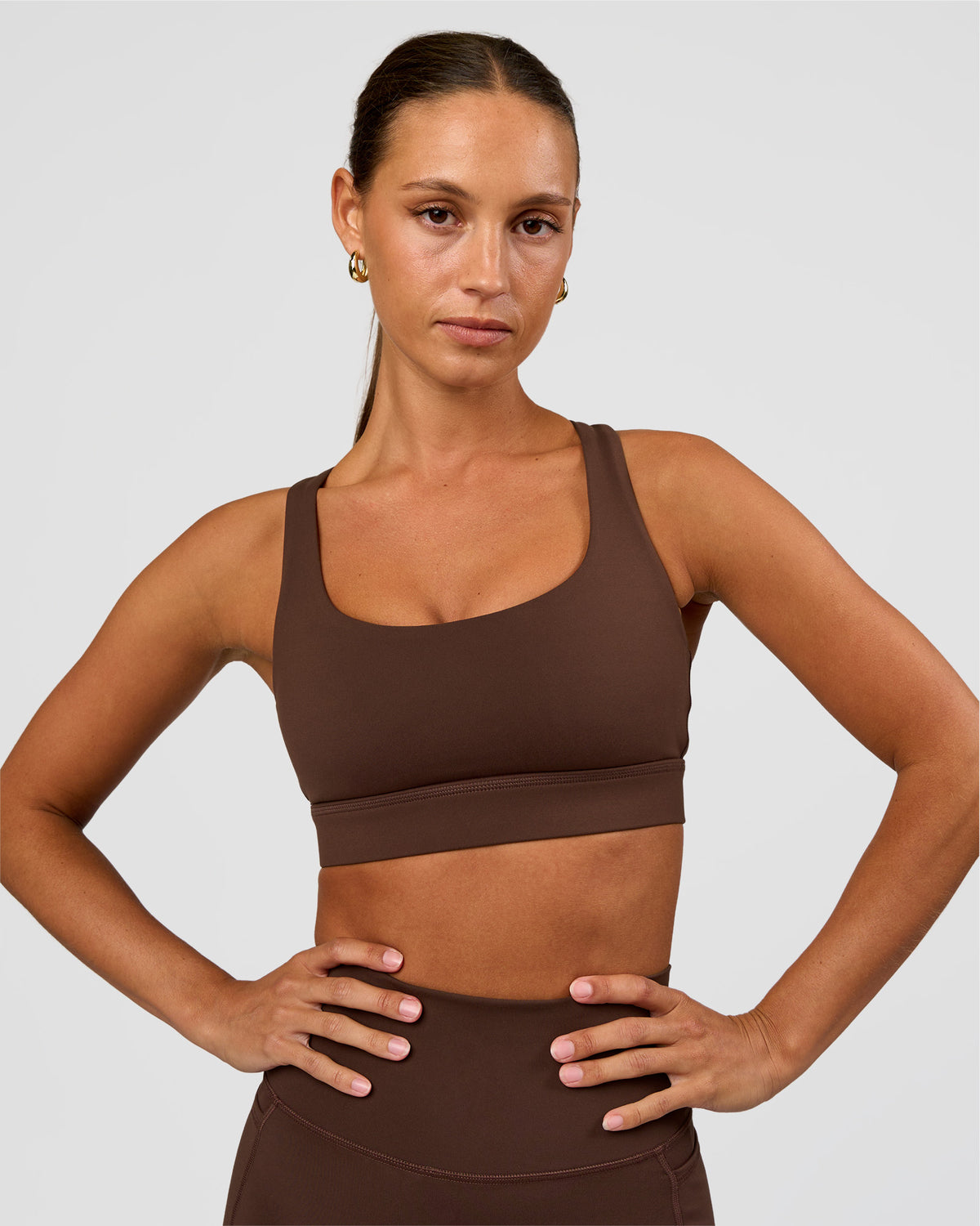 Woman wearing Race Day Sports Bra - Hot Chocolate | Model:Brylee | Size:XS