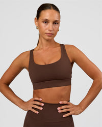 Woman wearing Race Day Sports Bra - Hot Chocolate | Model:Brylee | Size:XS | Thumbnail Index: 0