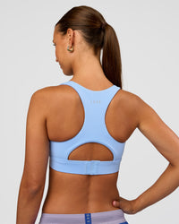 Woman wearing Race Day Sports Bra - Open Air | Model:Brylee | Size:XS | Thumbnail Index: 1