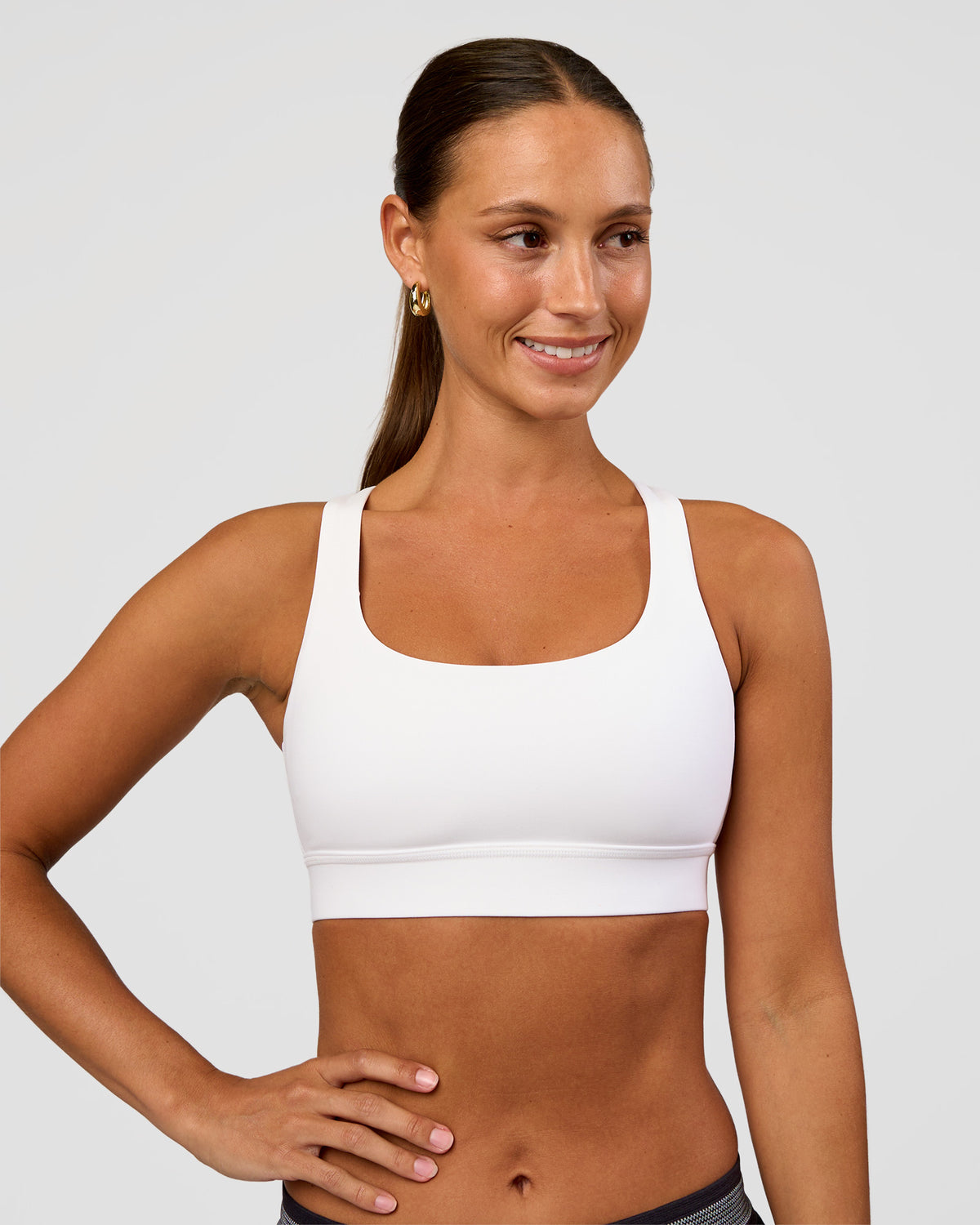 Woman wearing Race Day Sports Bra - White | Model:Brylee | Size:XS