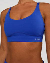 Woman wearing Rapid Sports Bra - Electric Indigo | Model:Brylee | Size:XS | Thumbnail Index: 4