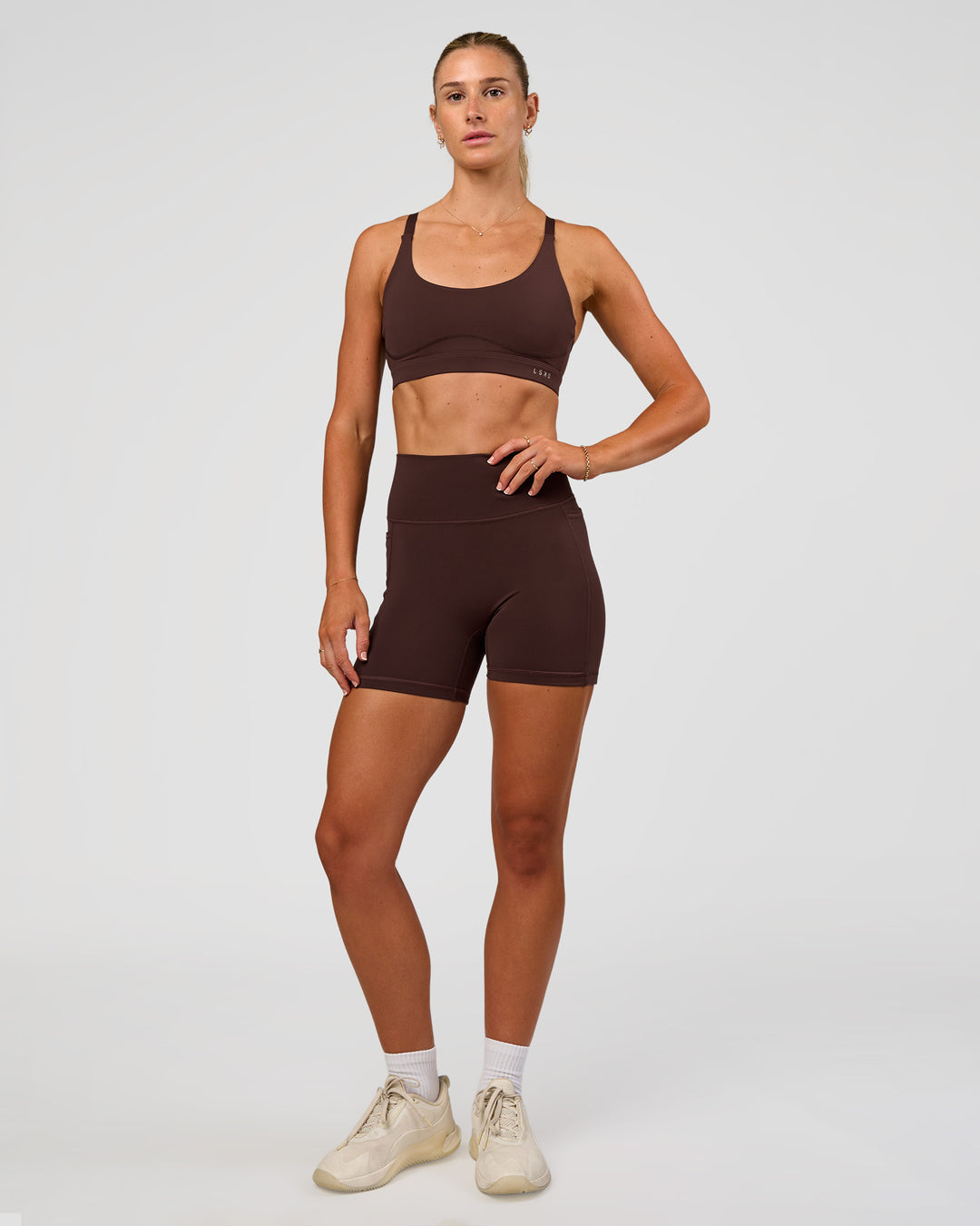 Woman wearing Rapid Sports Bra - Hot Chocolate | Model:Emelia | Size:XS - view 5